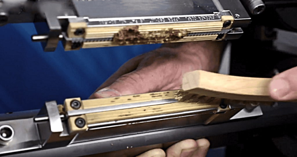 Cleaning Sealing Jaws with a Brass Brush