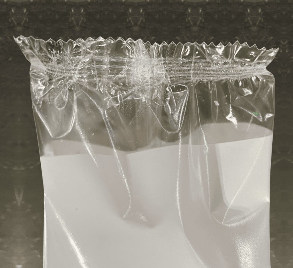 Package from flow wrapper with wrinkles and leakers