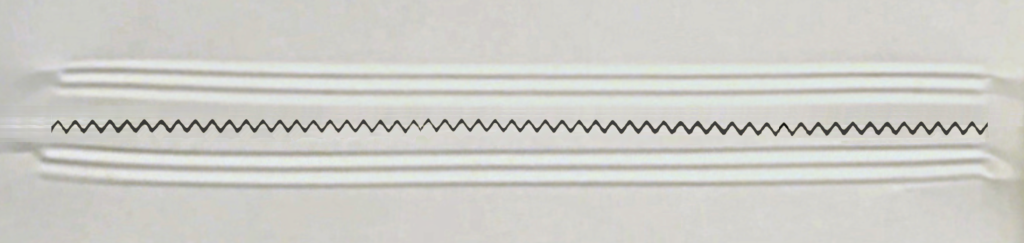 Adjustment screw style knife adjustment procedure for flow wrapper complete cut